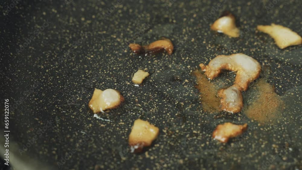 Lard with the symbol Question mark is fried in a frying pan. Harmful