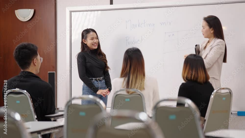 University College instructors and advisors meet female college students to advise their research study. University in classroom campus, college professor teacher and asian students discuss, teamwork University College instructors and advisors meet female college students to advise their research study. University in classroom campus, college professor teacher and asian students discuss, teamwork