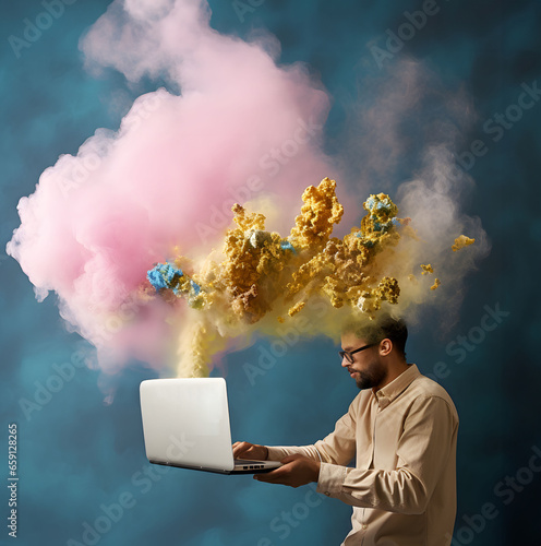 A man with colorful smoke above his head and a laptop