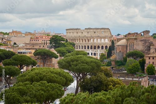 View of roofs of Rome under cloudy sky.