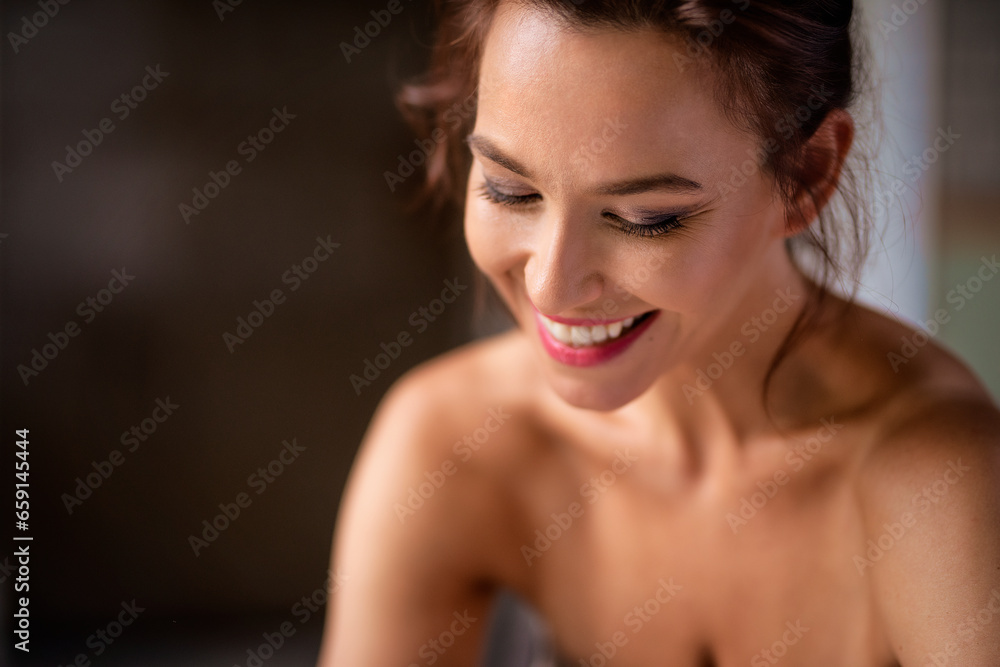 Close-up portrait of an attractive woman sitting inside and cheerful smiling Close-up portrait of an attractive woman sitting inside and cheerful smiling