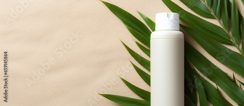 Natural concept Unbranded white plastic bottle mockup on sand texture with dried twig and green leaves