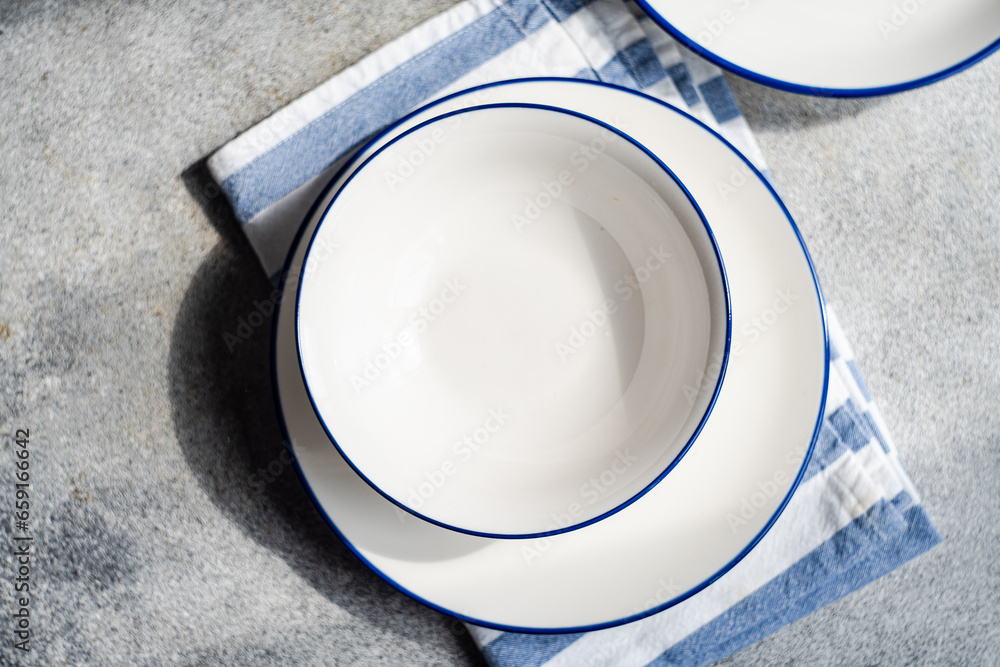 Minimalistic rustic table setting on gray surface Minimalistic rustic table setting on gray surface