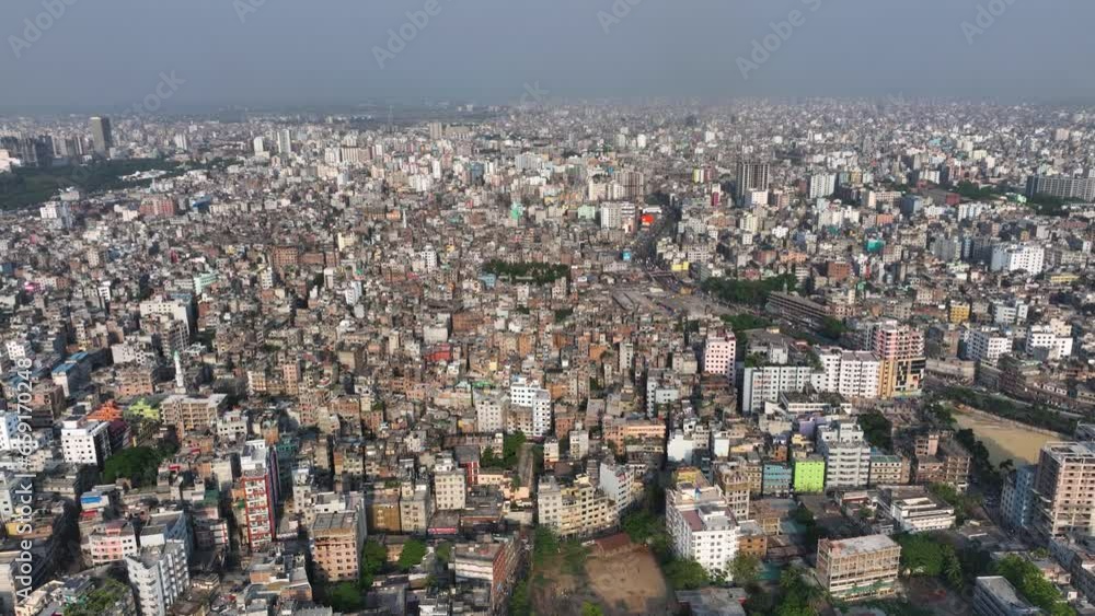 Aerial view of Dhaka city, the vibrant and bustling capital of Bangladesh. The cosmopolitan city is a blend of modern and traditional, with towering skyscrapers, bustling markets. Buriganga