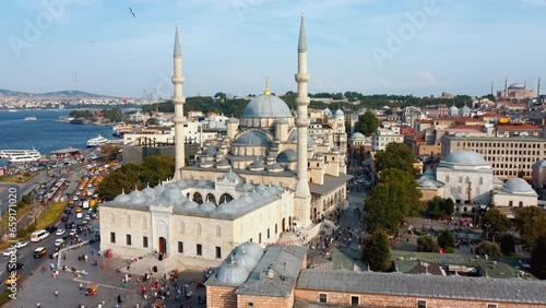 Drone view of Eminonu Yeni Cami district of Istanbul in Turkey or New Mosque. Architecture of Ottoman Mosque. view from height or air of former Constantinople. Tourist place tourists. Religion islam. photo