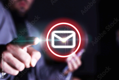 Unrecognizable person using mobile phone and tapping finger on pop-up email icon