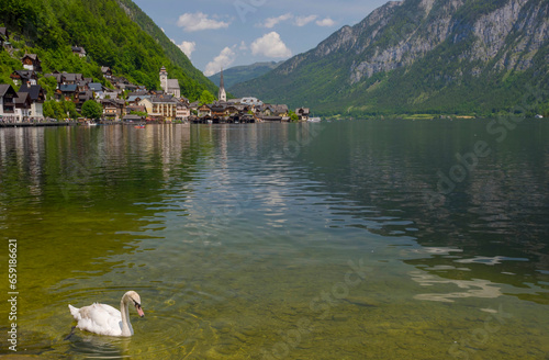 Obraz na płótnie Hallstatt, a charming village on the Hallstattersee lake and a famous tourist attraction, with beautiful mountains surrounding it, in Salzkammergut region, Austria, in summer sunny day. w salonie
