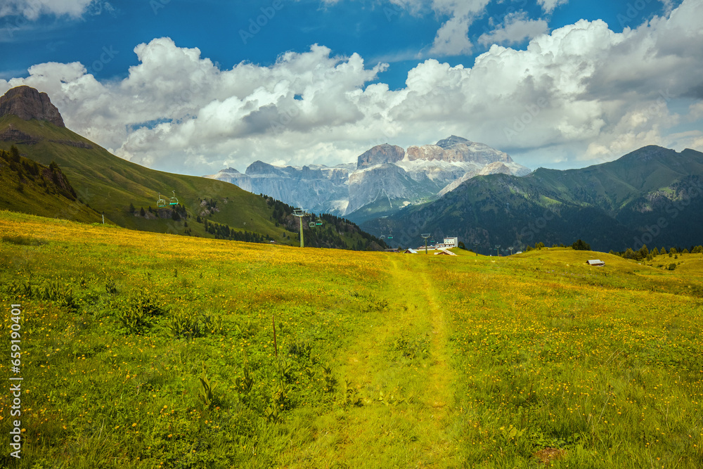 landscape with mountains, clouds, meadow and trail landscape with mountains, clouds, meadow and trail