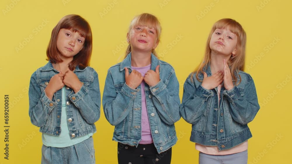 Please, God help. Teenage girls praying, making wish, asking with hopeful imploring expression, begging apology, forgiveness. Little children sisters. Three siblings kids isolated on yellow background Please, God help. Teenage girls praying, making wish, asking with hopeful imploring expression, begging apology, forgiveness. Little children sisters. Three siblings kids isolated on yellow background