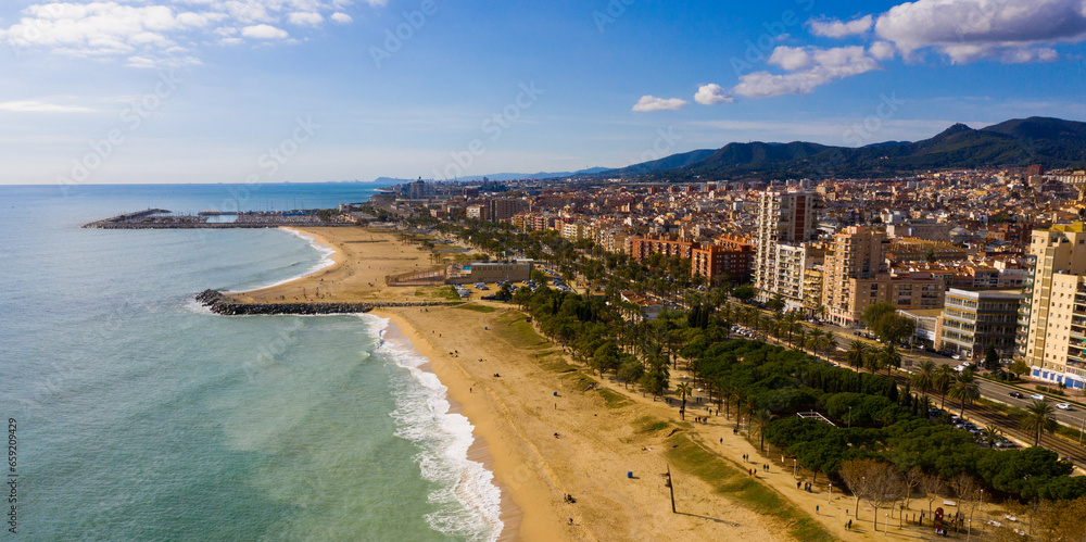 Scenic view from drone of large coastal Spanish town of Mataro on sunny winter day, Catalonia