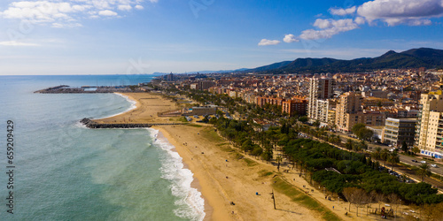 Photography Scenic view from drone of large coastal Spanish town of Mataro on sunny winter d