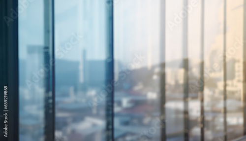 Blurred images of glass wall with city town background.modern abstract window for banner