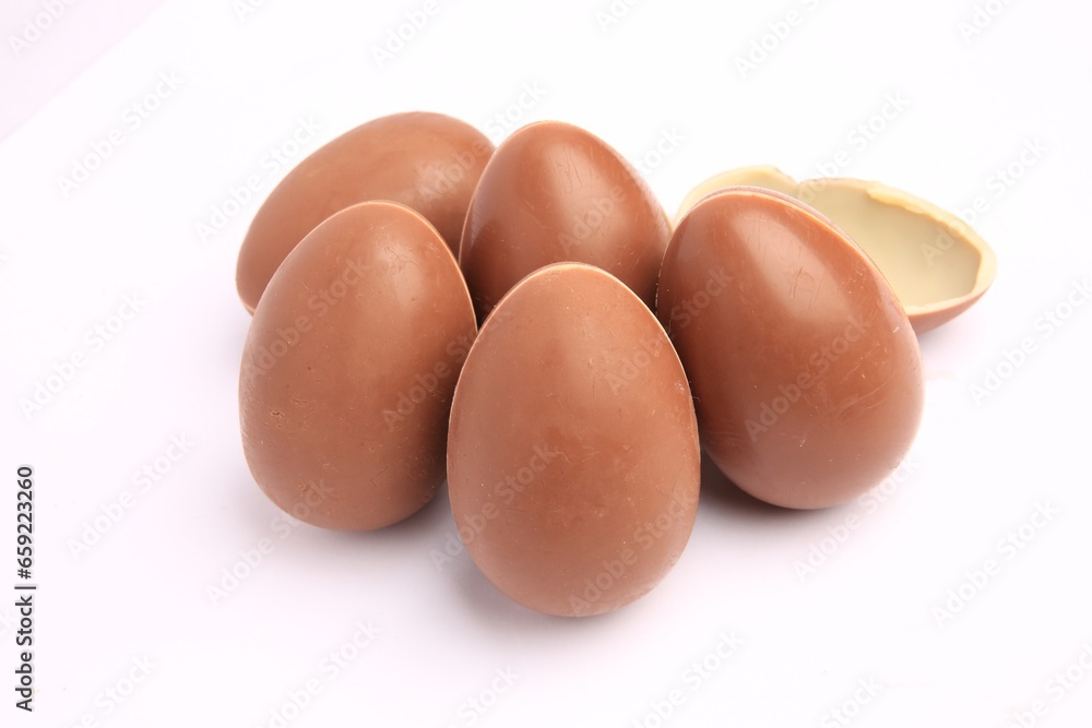 Sveti Vlas, Bulgaria - June 27, 2023: Unwrapped Kinder Surprise Eggs isolated on white Sveti Vlas, Bulgaria - June 27, 2023: Unwrapped Kinder Surprise Eggs isolated on white