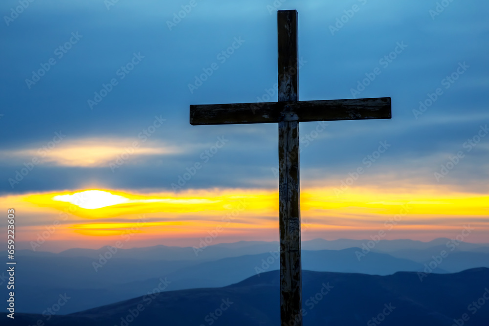 wooden cross on a background of sunrise in the mountains wooden cross on a background of sunrise in the mountains