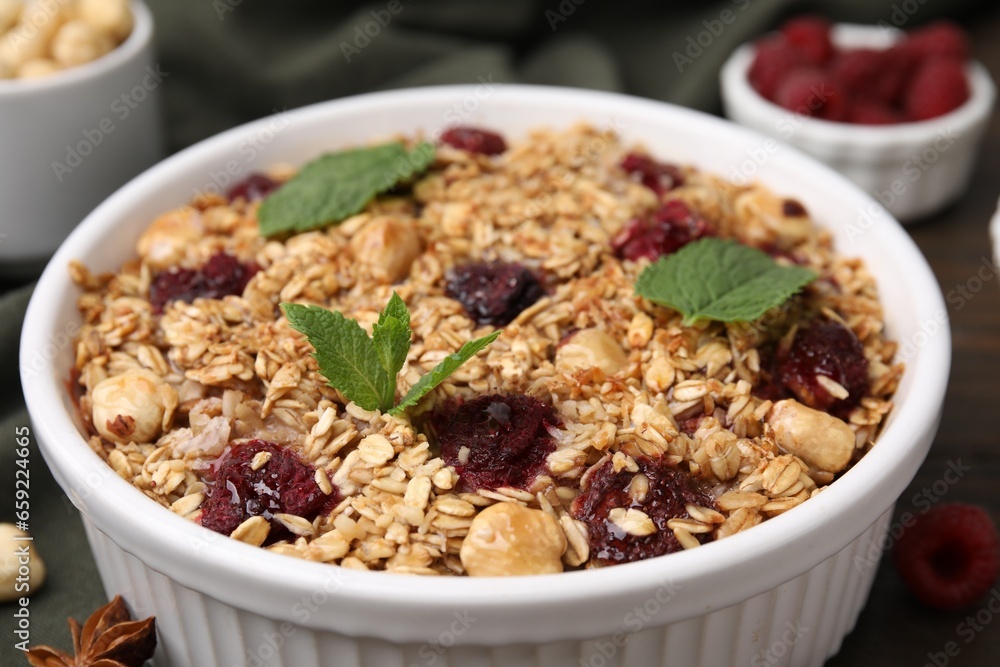 Tasty baked oatmeal with berries and nuts on table, closeup Tasty baked oatmeal with berries and nuts on table, closeup