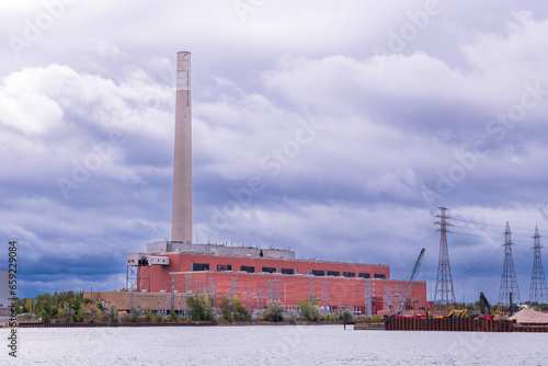 Photography coal fired electrical generation plant (decommissioned) with tall smoke stack in