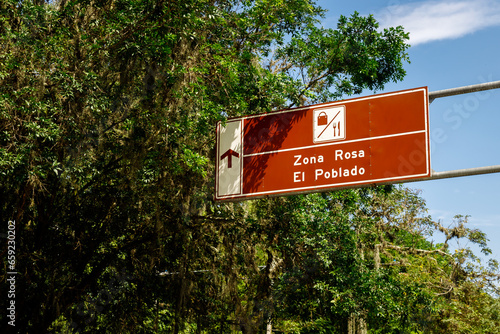 Street sign indicating Zona Rosa and El Poblado in Medellin, Colombia
