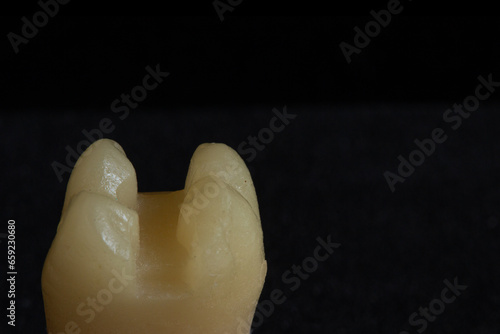 Cavity preparation in an artificial dental tooth. Selective focus.