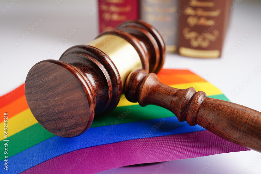 Gavel for judge lawyer with heart rainbow flag, symbol of LGBT pride month.