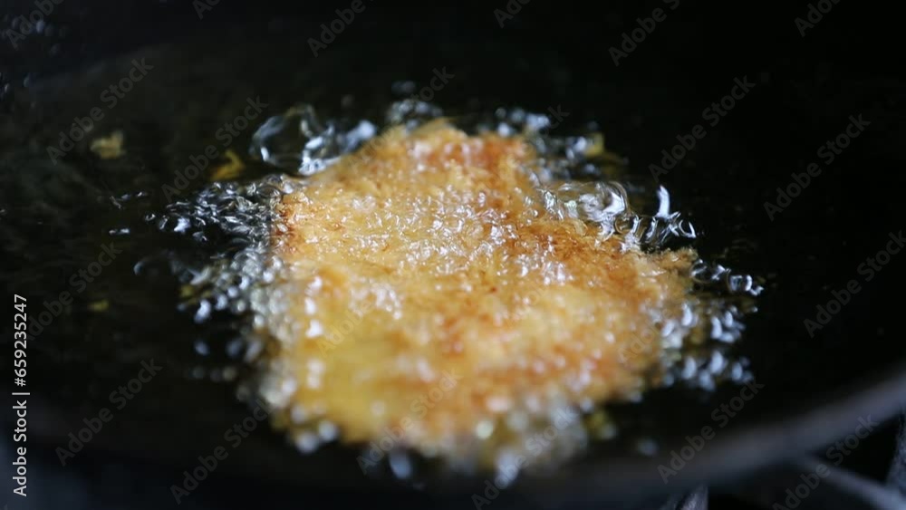 Fried chicken in a frying pan. Shallow depth of field. Fried chicken in a frying pan. Shallow depth of field.