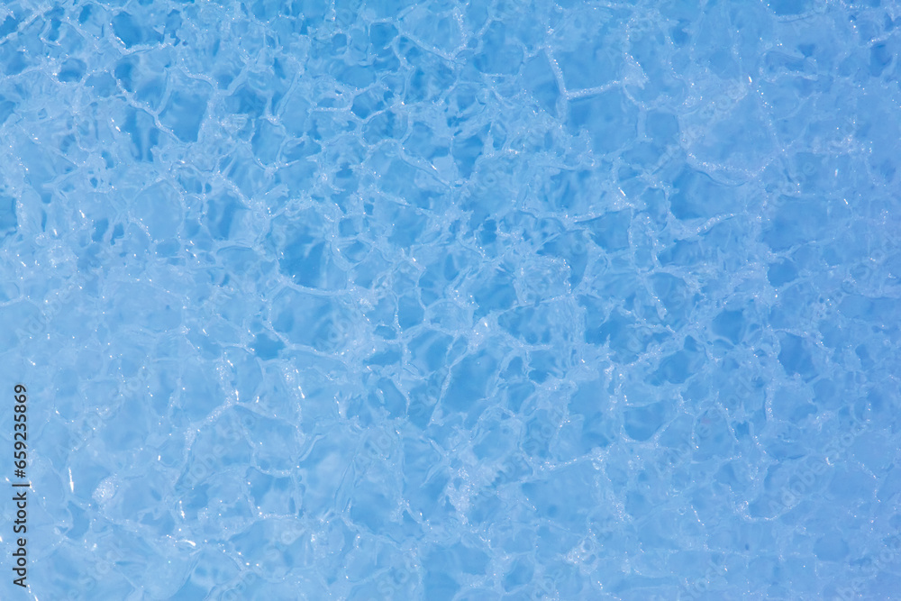 Texture of winter ice surface. Blue natural ice background Texture of winter ice surface. Blue natural ice background