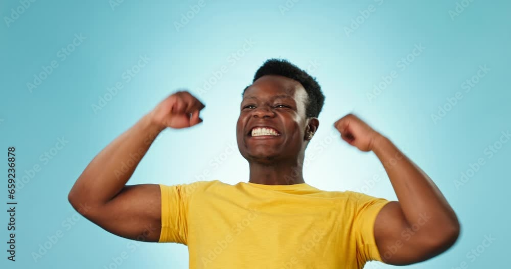 Studio, excited or happy black man celebration, smile and happiness for success, giveaway or lotto news. Winner achievement, energy or African person cheers for winning competition on blue background Studio, excited or happy black man celebration, smile and happiness for success, giveaway or lotto news. Winner achievement, energy or African person cheers for winning competition on blue background