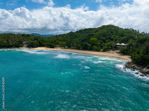 Aerial view seashore with mountains at Phuket Thailand, Beautiful seacoast view at open sea in summer season,Nature recovered Environment and Travel background