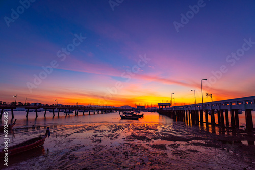 Chalong pier during sunrise or sunset beautiful colorful dramatic sky in Phuket thailand