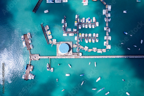 Aerial View Drone shot of Yacht and sailboat parking in marina, Transportation and travel background, Beautiful sea in summer season