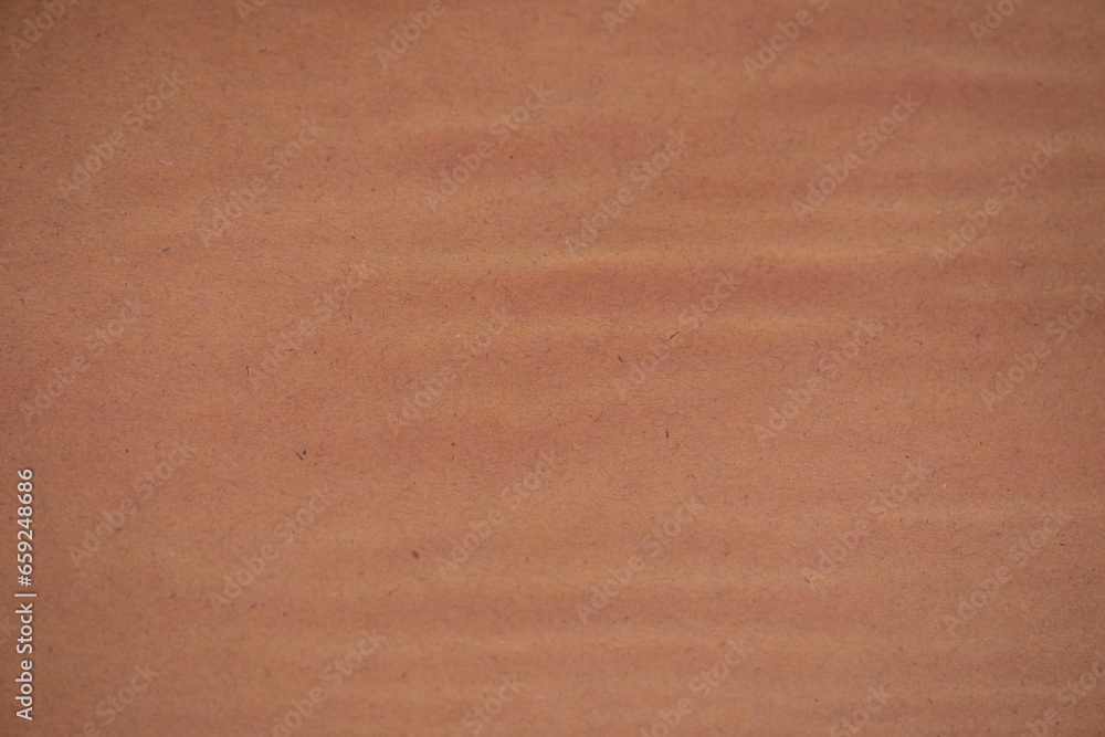 Fototapeta premium Brown waves corrugated cardboard texture background. Brown paper cardboard with soft color. Brown corrugated cardboard texture is useful as a background.