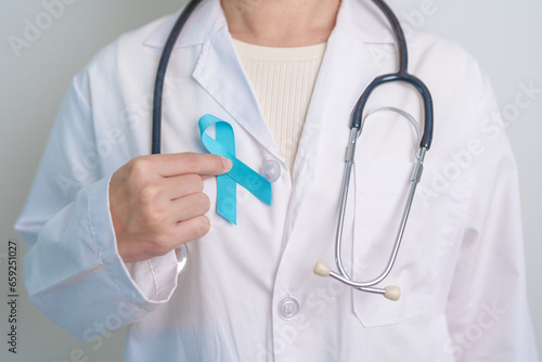 Blue November Prostate Cancer Awareness month, Doctor with Blue Ribbon in hospital for support people life and illness. Healthcare, International men, Father, Diabetes and World cancer day © Jo Panuwat D