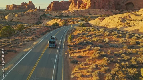 Paved Road Of The Scenic Arches Drive During Sunset In Utah, United States. Aerial Shot photo