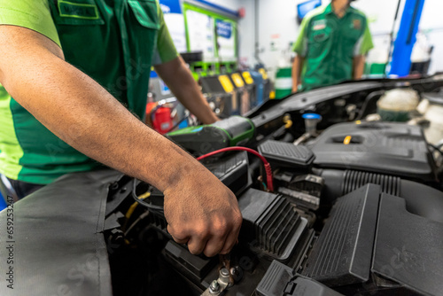 Close up view of a Maintenance Car service - auto oil change, motor check, brake cleaning, tire check, engine inspection, motor oil-brake inspection © Gian