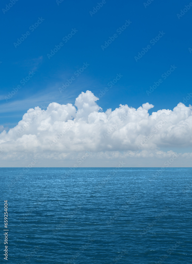 White cumulus clouds above blue Ocean White cumulus clouds above blue Ocean