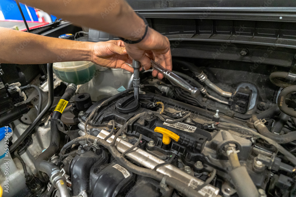 Close up view of a Maintenance Car service - auto oil change, motor check, brake cleaning, tire check, engine inspection, motor oil-brake inspection