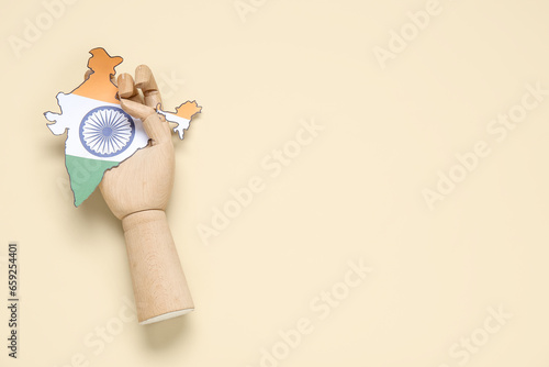 Wooden hand with paper Indi...