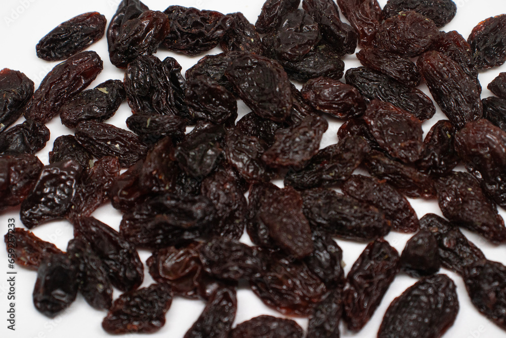 dried raisins on isolated background dried raisins on isolated background