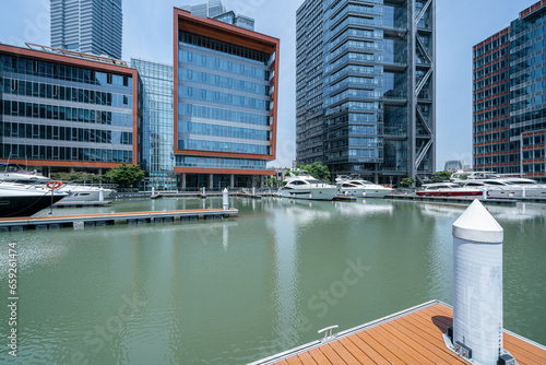Photography financial district buildings of shanghai  in sunny day and the yacht docked at t