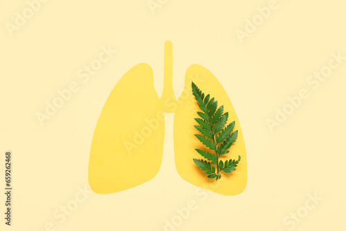 Paper lungs with green leav...