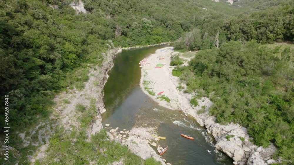 Canoe And People on the Beach By Ardeche River At Daytime in Summertime - Aerial Canoe And People on the Beach By Ardeche River At Daytime in Summertime - Aerial