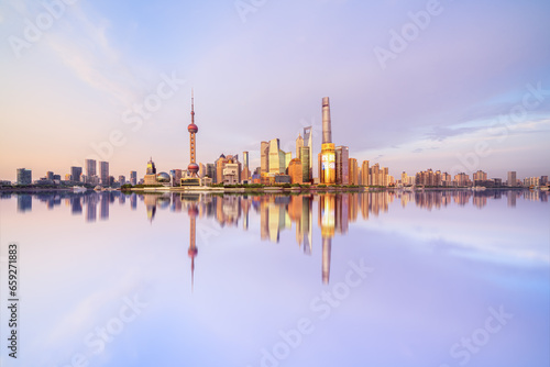 Illuminated Shanghai Skyline Reflecting On River 