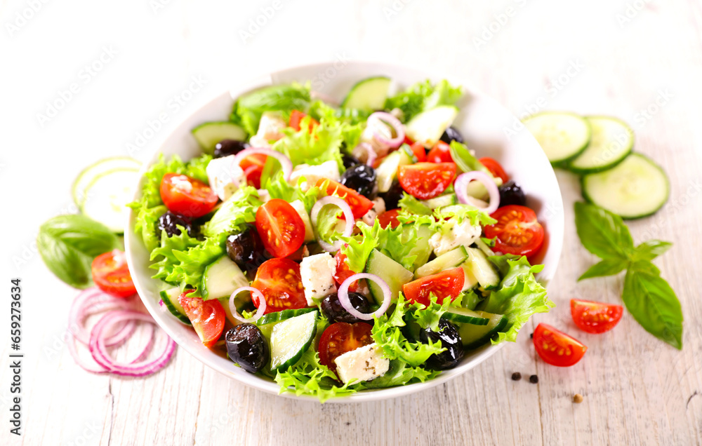 greek salad with lettuce, tomato,onion, feta cheese greek salad with lettuce, tomato,onion, feta cheese