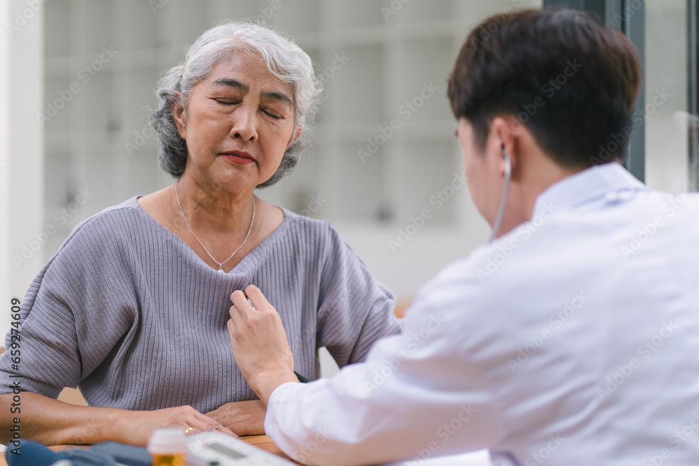 Healthcare, senior female patient and male doctor with blood pressure test, help and wellness checkup of person at hospital. Healthcare, senior female patient and male doctor with blood pressure test, help and wellness checkup of person at hospital.