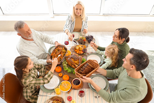 Happy family having dinner ...