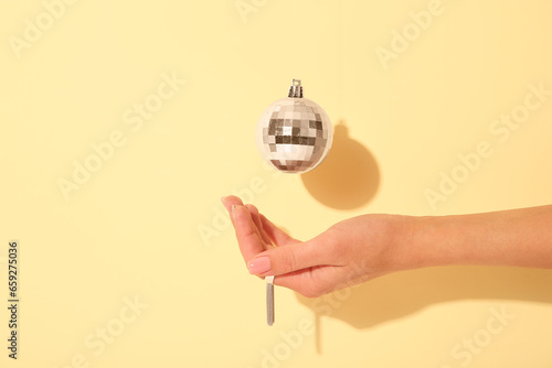 Female hand holding a shiny...