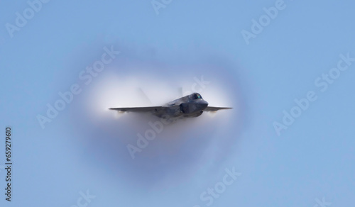 Fighter Jet with fog on the wing