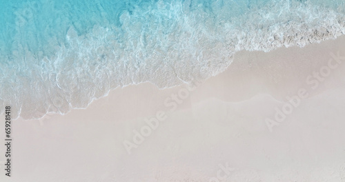 Beach Wave water in the Tropical summer beach with sandy beach background