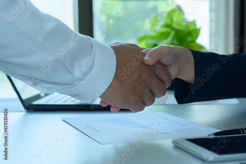 Business people, handshake and meeting business cooperation concept. Business finance, investment, teamwork and successful business employees shaking hands congratulation in team