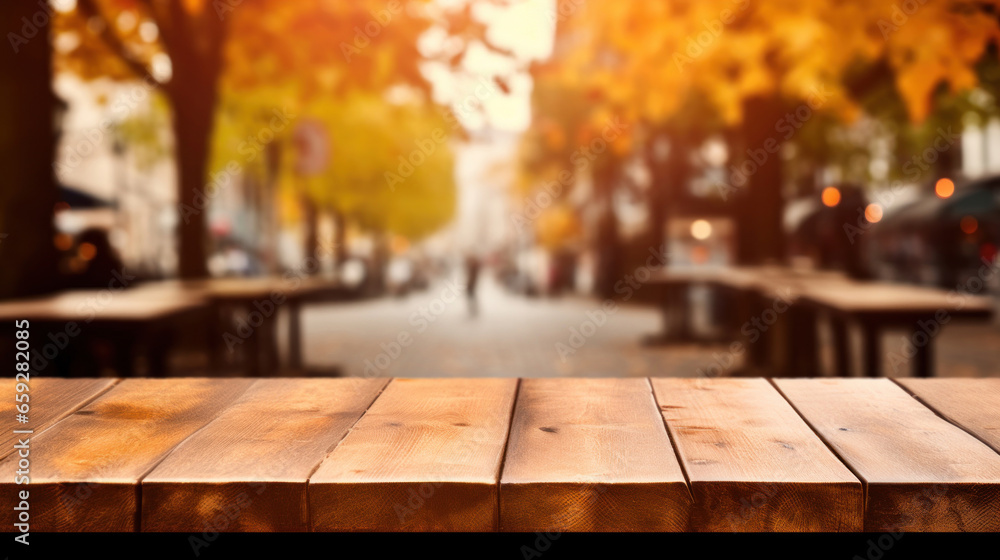 Empty wooden table top with blur background of city street in autumn Empty wooden table top with blur background of city street in autumn