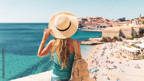 Φωτογραφία Woman tourist enjoying view of Dubrovnik city and beach- Travel, tour tourism in